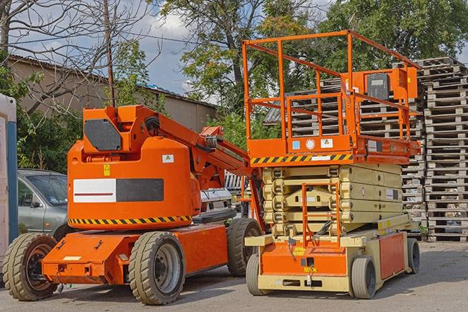 industrial forklift lifting heavy loads in warehouse in Crowley